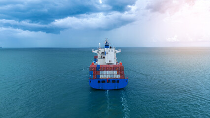 Wall Mural - Stern of Cargo container ship on beautiful sky cloud carrying container and running out international container port customs shipyard sea port concept smart logistic