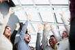 © Katsiaryna - High angle view of group of happy multiethnic people raising hands together