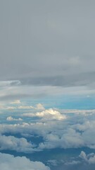 Wall Mural - Blue Sky and White Clouds seen from airplane in Thailand - On the way from Nan to Bangkok - Blue Nature Footage 