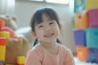 © darshika - happy  smiling female asian caucasian kid playing