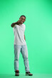 © Katsiaryna - A man, full-length, on a green background, calls to him