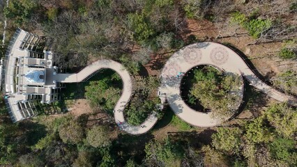 Wall Mural - Aerial view of the skywalk in Phayao province of Thailand. Located on Wat Phrathat Chom Thong temple for viewing Phayao lake the largest freshwater lake in the northern Thailand.