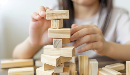 Wall Mural - Child plays with wooden blocks.