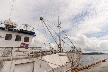 Wall Mural - Old decommisioned trawler at port.