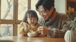 © VISUAL BACKGROUND - Father and daughter share ice cream.