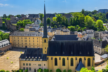 Wall Mural - Saint John’s Church or Saint John on the Stone (Eglise Saint-Jean, 1705) in the valley and the river Alzette. Church St Jean of Grund belonged to the Benedictine Abbey of Munster. Luxembourg City.