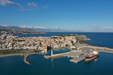 Poster - City by the sea on a clear day with blue skies