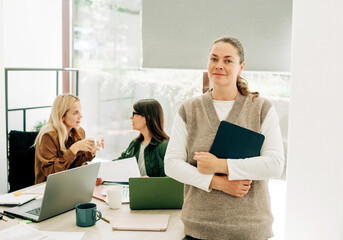 Wall Mural - Portrait of a modern attractive business woman in the office.