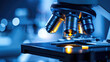 © scaliger - Digital microscope for research in dark blue laboratory close-up, modern equipment in medical lab. Concept of technology, medicine, science, cancer, virology, microbiology