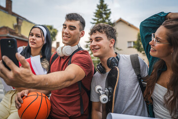 Wall Mural - group of teenage students self portrait selfie of gen z sit in campus