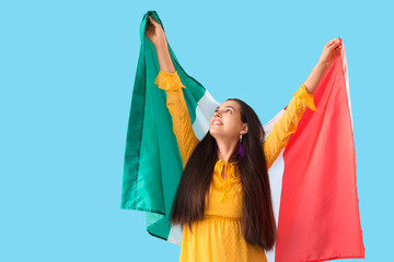 Canvas Print - Young woman with Mexican flag on blue background