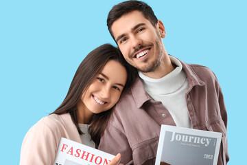 Sticker - Young couple with magazines on blue background