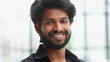 © Katsiaryna - Headshot of skilled Hindu male worker in front of office