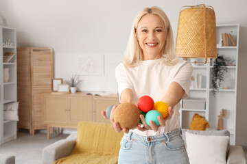Wall Mural - Mature woman with massage balls at home