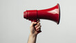 © labirint - Hand holding a red megaphone