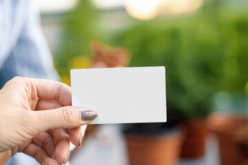 person holding a blank card