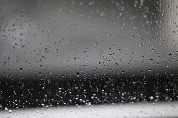 Wall Mural - Water drops on fogged glass with a gray brightness gradient