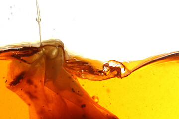 Wall Mural - Close up shot of steeping tea bag in hot water