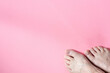 © Deborah - Discolored and dry toenails from chemotherapy treatment for breast cancer.  Side effects. Pink background.