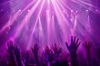 © LimeSky - Fans hands raised at concert with purple light rays in the background
