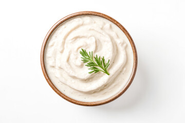 Wall Mural - Creamy White Sauce in a Brown Bowl with a Sprig of Parsley