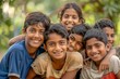© Chacmool - Group of indian kids smiling at camera on a sunny day.