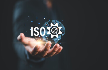 Poster - ISO standards quality control. Businessman hold virtual globe with quality assurance or guarantee product. ISO Standard certification. Modern ISO banner.