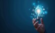 © Iswanto - Light bulb with innovation icons in businessman’s hand. Concept of business creativity and solutions.