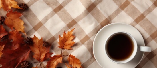 Poster - Autumn composition Cup of coffeecup autumn leaves on on white checkered cloth Flat lay top view copy space