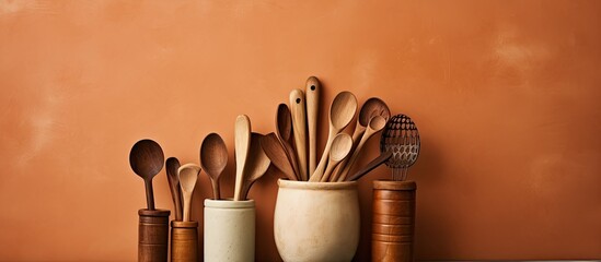 some kitchen utensils like wooden spoon and clay jug beberapa peralatan dapur seperti sendok kayu dan kendi tanah liat. copy space available
