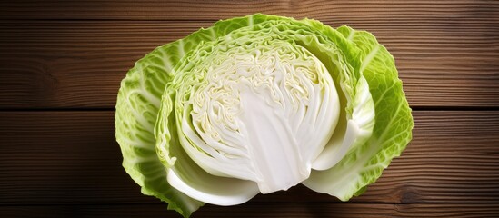 Poster - Raw sliced Pointed white cabbage Wooden background Top view Copy space