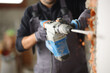 © Antonioguillem - Construction worker using rotary hammer to wreck wall