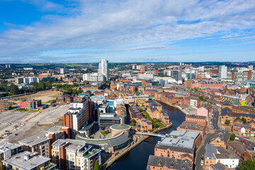 Wall Mural - Aerial photo of the Leeds City Centre taken from the area known as The Leeds Dock on a bright sunny summers day showing apartments on either side of the Leeds and Liverpool canal
