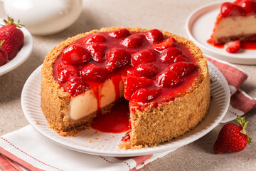 Wall Mural - Breakfast with classic baked cheesecake  with a strawberry topping sauce. Homemade fruit pie.