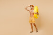 © ViDi Studio - Full body fun happy young man wear yellow shorts swimsuit hat relax rest near hotel pool with rubber ring hand at forehead look far away isolated on plain beige background. Summer sea sun tan concept.