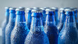 © SashaMagic - Blue bottles with condensation, grouped closely together.