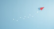 © Smile Studio AP - Red paper plane isolated on blue background, concept of volatility in business and investment, graph with arrow up