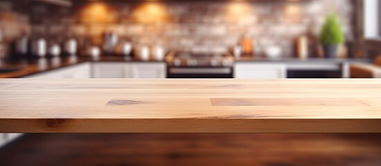 Poster - Blurry kitchen background with a wooden tabletop for product display or design with copy space image