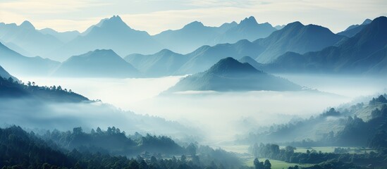 Wall Mural - Spectacular view of a mist covered mountain valley with a beautiful scene and copy space image