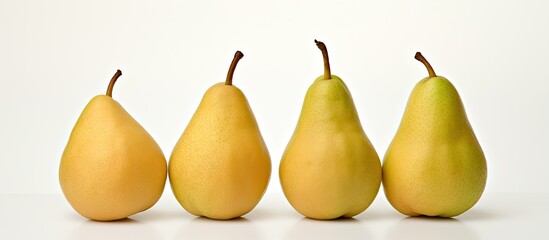 Sticker - Three ripe Packham pears arranged at various angles on a white background with copy space image