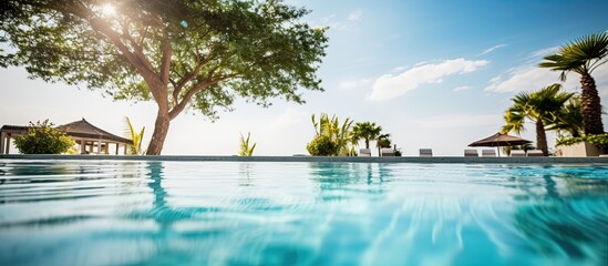 Canvas Print - Hotel and resort featuring a luxurious outdoor swimming pool near a comfortable bed with a picturesque view perfect for travel and vacation with copy space image