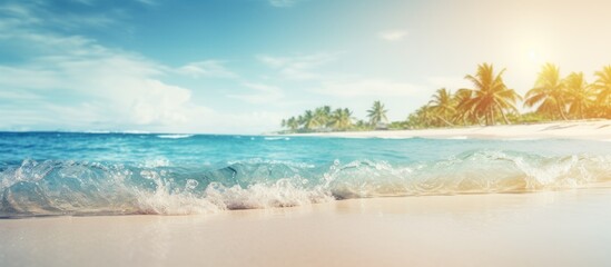 Canvas Print - A blurred tropical beach backdrop with sunlit bokeh waves Ideal for summer vacation and travel themes with a vintage color tone filter and copy space image