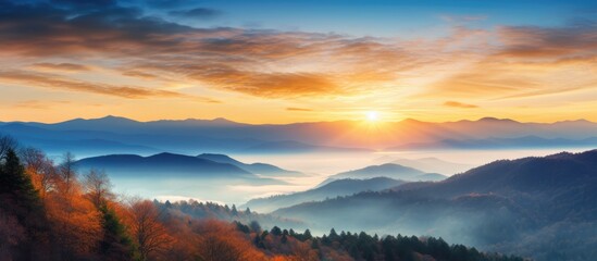 Wall Mural - Scenic sunrise over a vibrant fall mountain landscape with copy space image