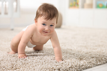 Canvas Print - Cute baby boy crawling on carpet at home. Space for text