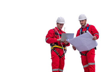 Engineer factory electrical using a notebook computer and blueprint standing at a power station planning work producing electrical energy with white background.