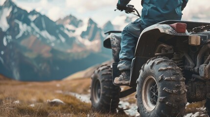 Sticker - A person riding a four wheeler on a mountain. Suitable for outdoor activities promotion