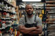 © AIGen - Store Worker. Afro American Hardware Salesman Crossing Arms in Retail Store