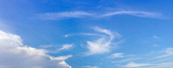 Wall Mural - Blue sky background with tiny clouds. Cloudscape - Blue sky and white clouds. Clouds with blue sky