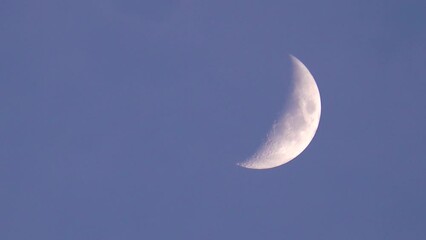 Wall Mural - Moon as natural earth satellite in waxing crescent phase in evening sky