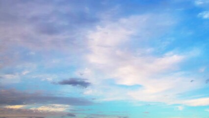 Wall Mural - The evening sky gradually darkens. White clouds at sunset move slowly across the sky as night falls. Calm, nostalgic background with a feeling of slight sadness and sadness.